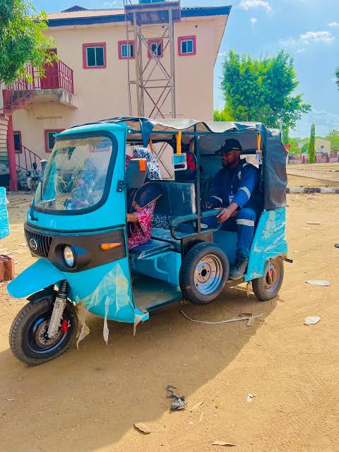 A driver seated in an Amana Rides tricycle in Sokoto